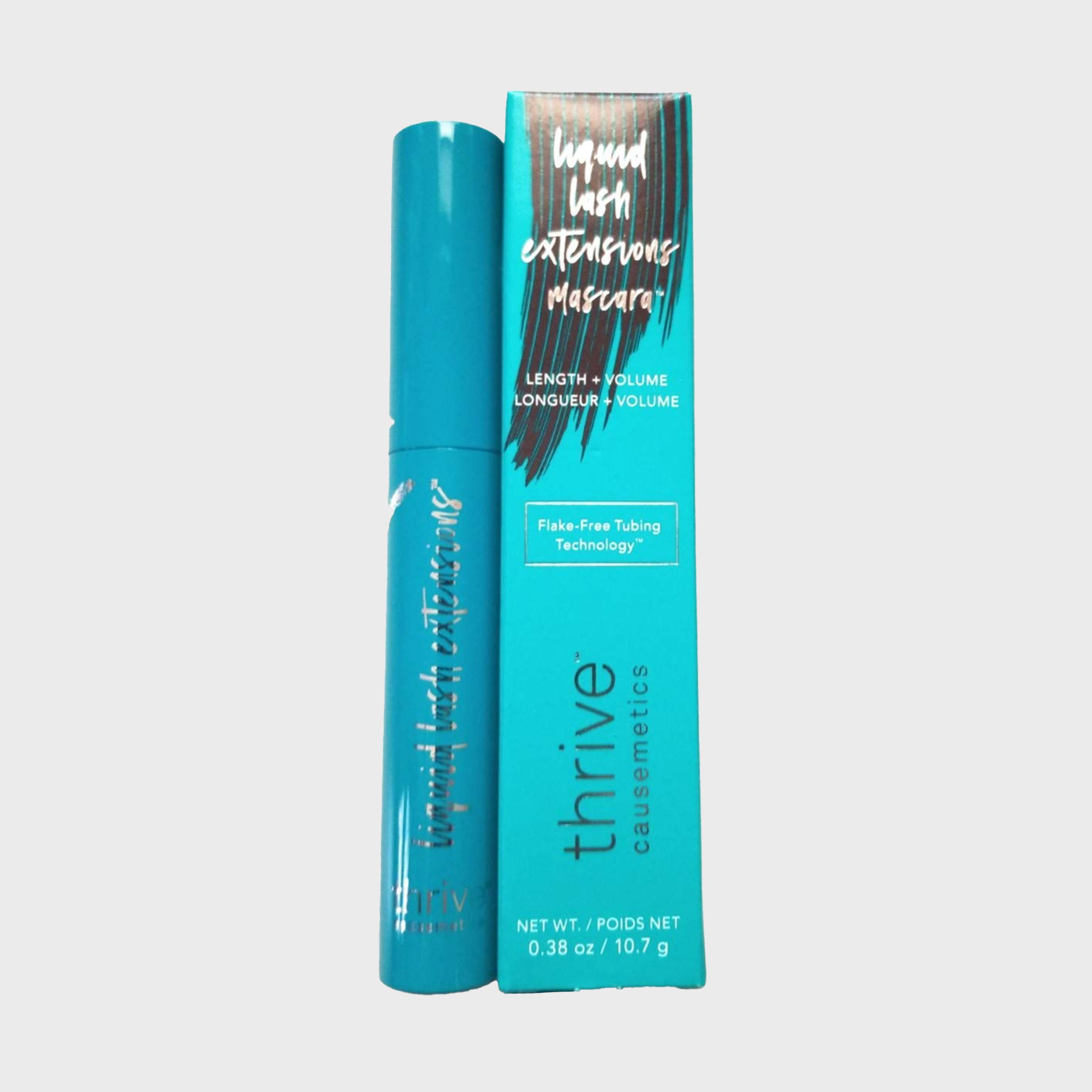 Teal mascara tube rests against a matching box displaying text, "liquid lash extensions mascara," promoting length, volume, and flake-free tubing technology.