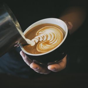 how to make latte art by barista focus in milk and coffee in vintage color