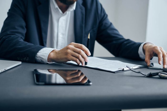 Business man working with documents at office desk in office.