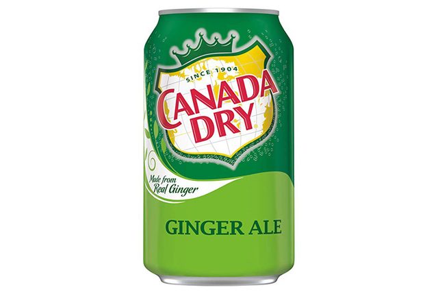 Green can displaying "Canada Dry" logo with "Ginger Ale" text, set against a white and yellow globe design, with a crown emblem on top.