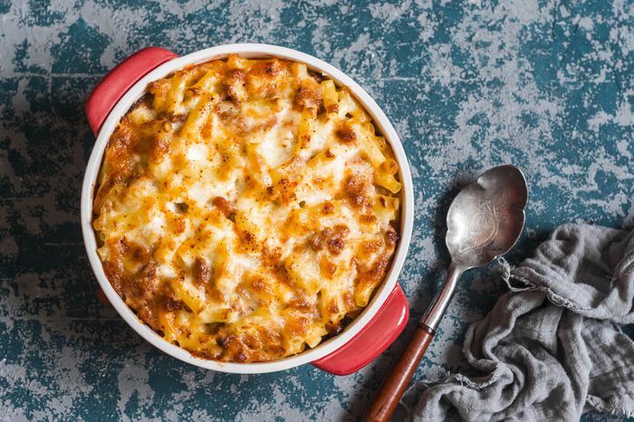 Mac and cheese. Macaroni and cheese with meat tomato sauce. Delicious lunch 
