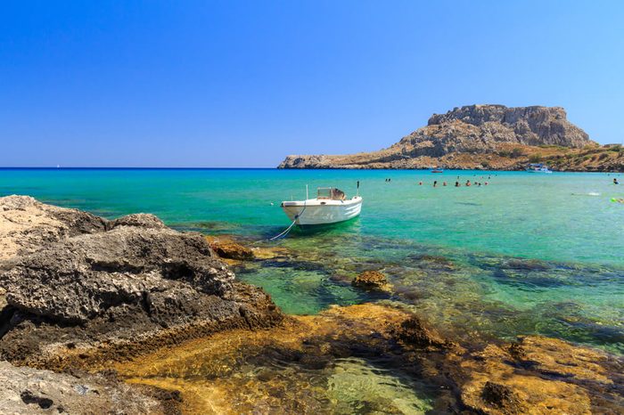 The stony beach at Rhodes Charaki, golden sand