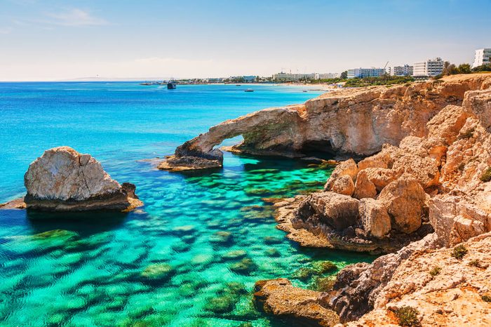 Beautiful natural rock arch near of Ayia Napa, Cavo Greco and Protaras on Cyprus island, Mediterranean Sea. Legendary bridge lovers. Amazing blue green sea and sunny day.
