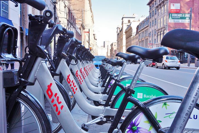 MONTREAL, CANADA - APRIL 2014 - Shared bikes are lined up in the streets of Montreal, Quebec. BIXI Montreal, launched in May 2009, has over 400 stations and 5000 bikes.