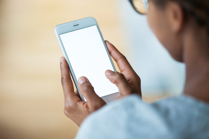 African american person holding a tactile mobile smartphone - Black people