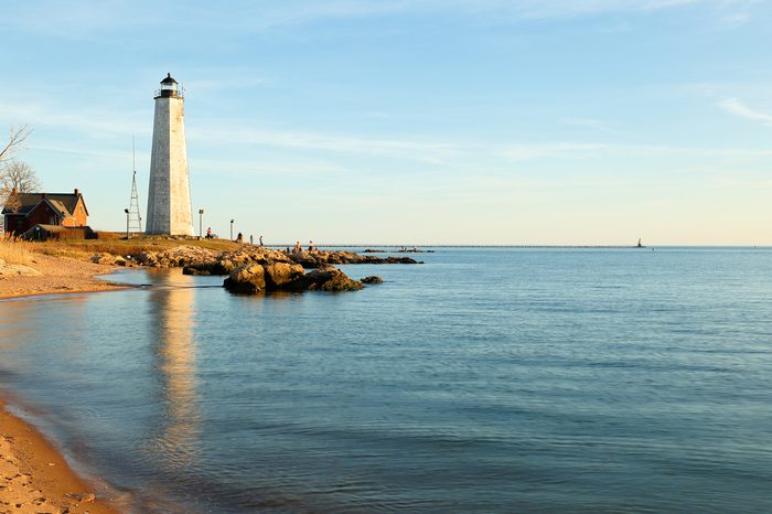 New Haven Light House at Lighthouse Point Park At Sunset. The lighthouse is dark, but the tower remains, greeting ships from around the world to New Haven.