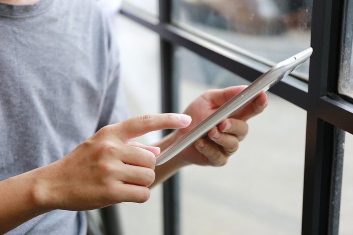 asian man hand use digital tablet , Internet of things lifestyle with wireless communication and internet with smart phone.