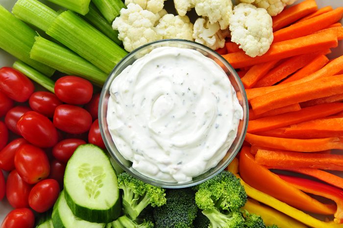 Platter of assorted fresh vegetables with dip
