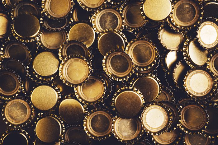 Beer bottle caps piled