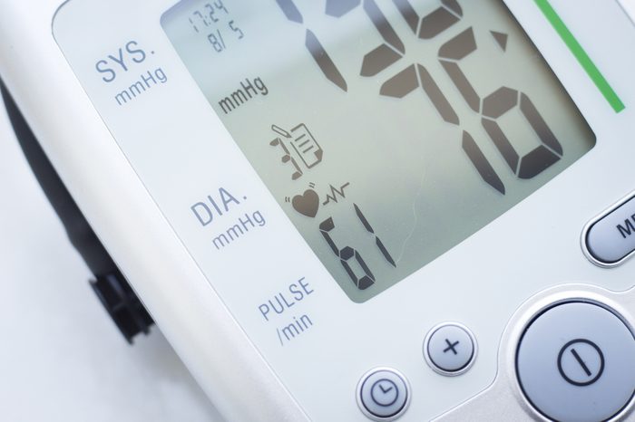 Portable hand held domestic cardiac blood pressure and irregular heart beat pulse rate meter to show resting heart rate in monitored patient.