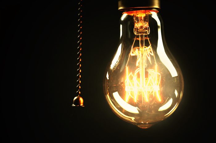 Light bulb on black background