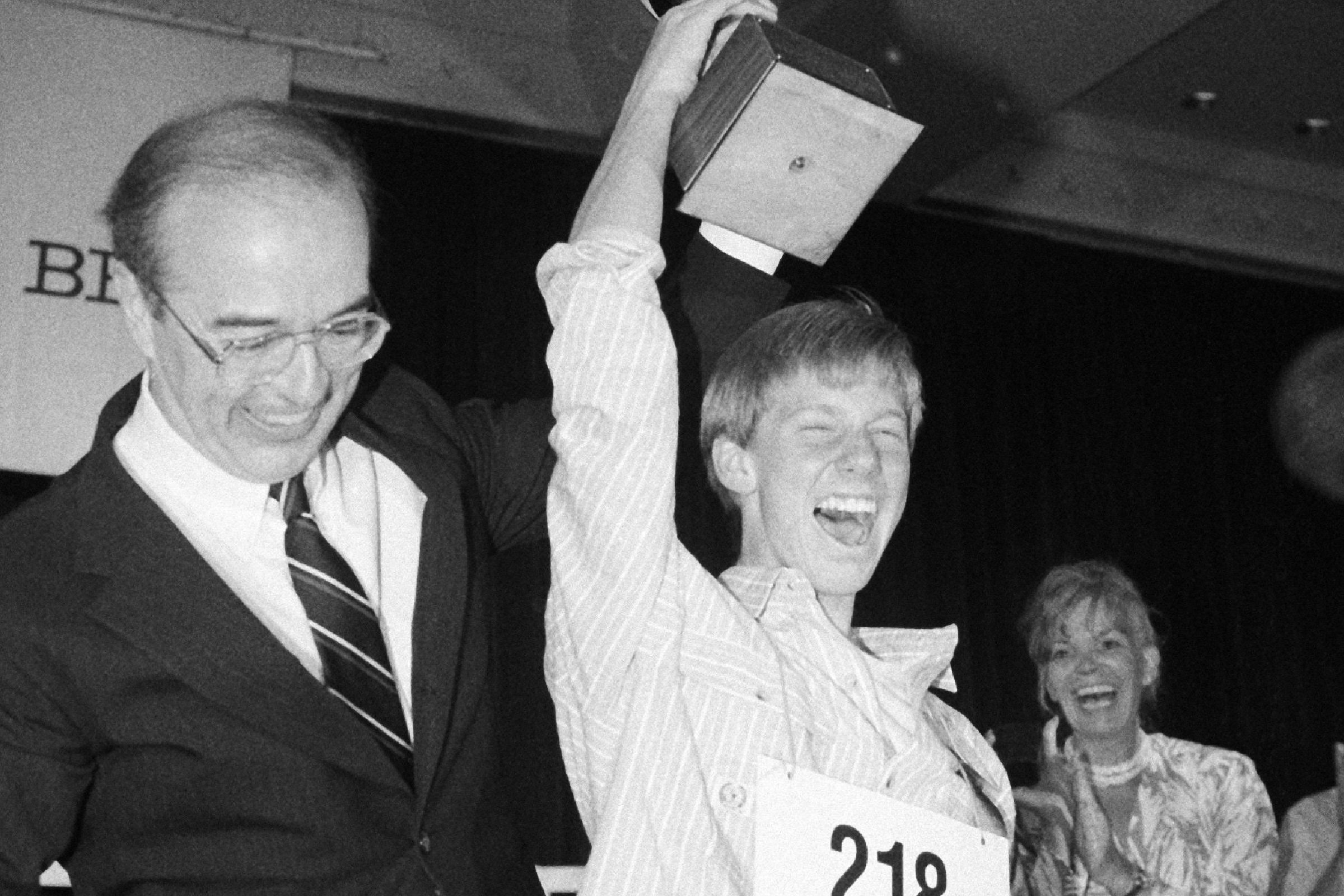 Watchf Associated Press Domestic News Washington United States APHS 62ND NATIONAL SPELLING BEE Scott Isaacs,14, of Litteton, Colorado, holds up a trophy after winning the 62nd annual National Spelling Bee in Washington . Isaacs an eight-grader correctly spelled "spolitor" to win the competition