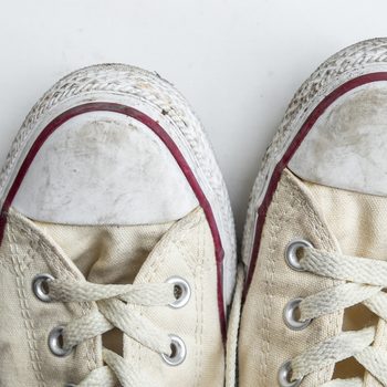 dirty sneakers isolated on a white background