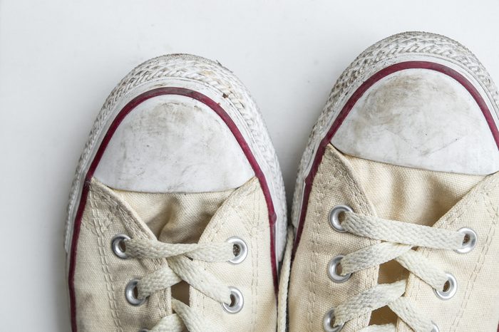 dirty sneakers isolated on a white background