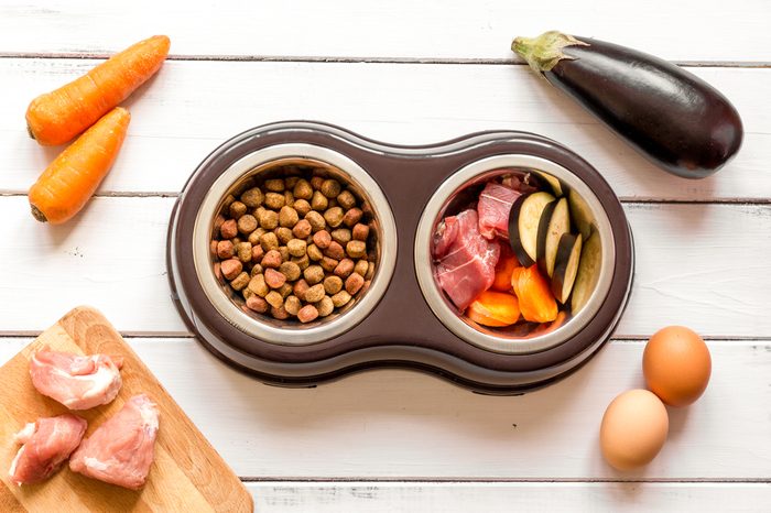 ingredients for pet food holistic top view on wooden background