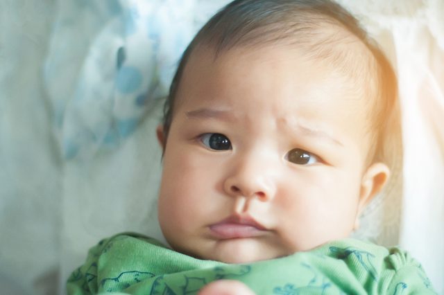 An Asian cute baby face, looking.