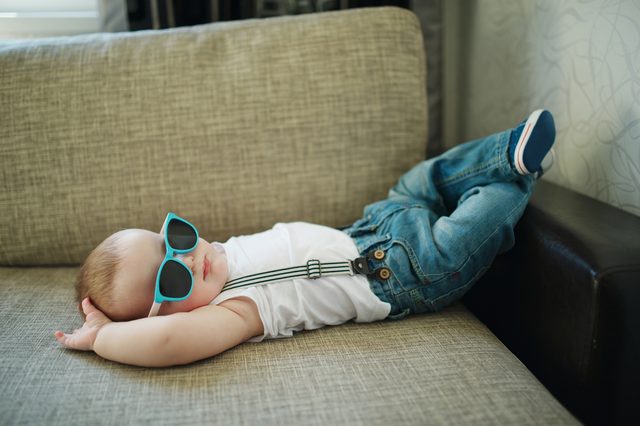 cute little boy in sunglasses at home