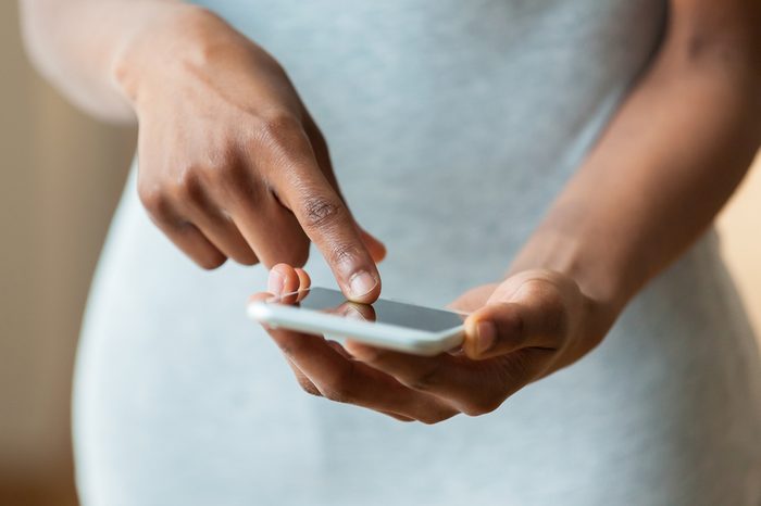 African american person holding a tactile mobile smartphone - Black people