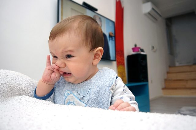 Baby face, cute baby is playing