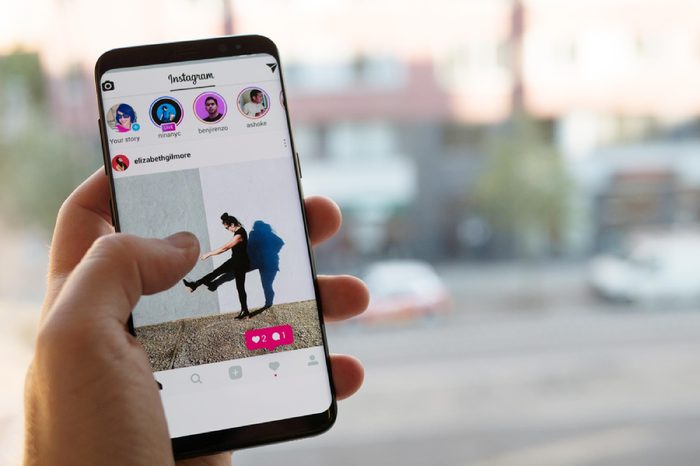 STOCKHOLM, SWEDEN - JULY 10, 2017: Man holding a smartphone with Instagram on the screen.
