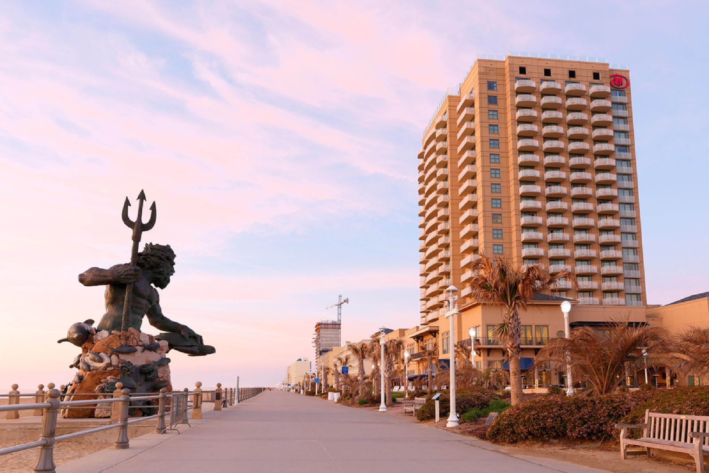 Virginia Beach, Virginia - April 2016: The Boardwalk of Virginia Beach at Sunrise. The Boardwalk is 28-feet wide and stretches three miles along the Virginia beach and is very popular for vacation.