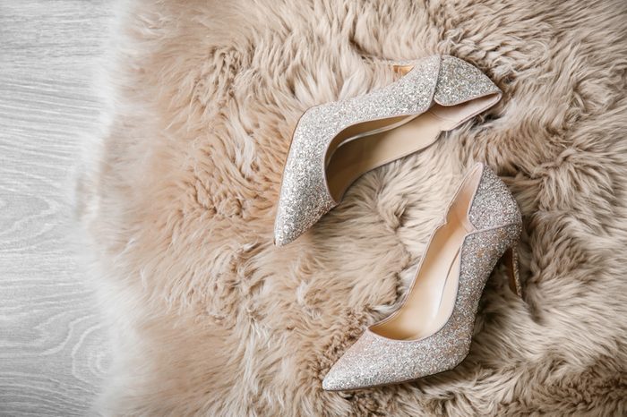 Beautiful high heeled shoes on furry rug