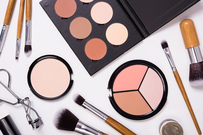 Professional makeup tools, flatlay on white background