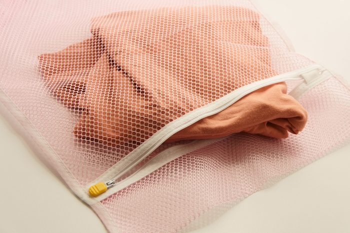 Nets laundry bag, for washing clothes in washing machine on white background.