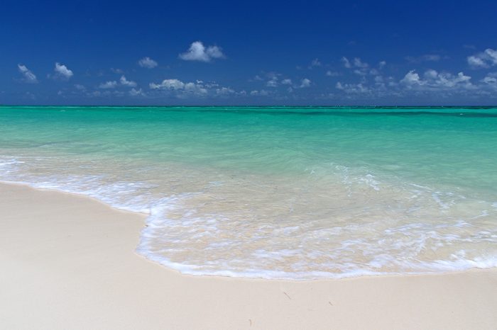 The pristine sands and crystal clear waters of Cable Beach, Nassau in the Bahamas.