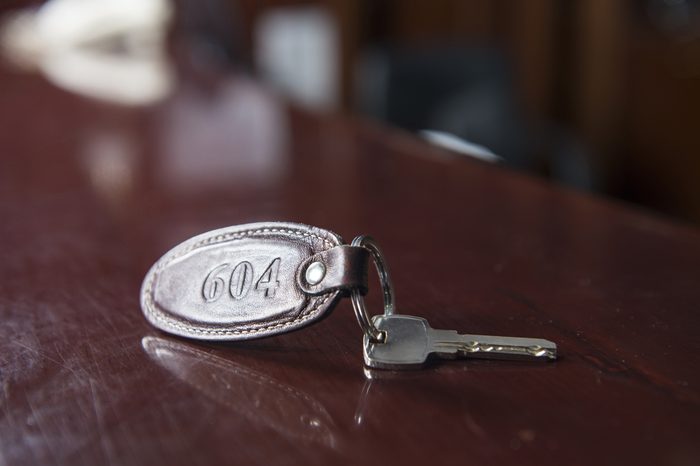 Key to a hotel room on a hotel reception desk.