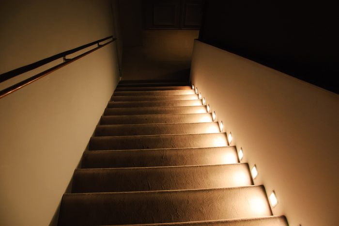 Illuminated stairs in the building. Suspense background.