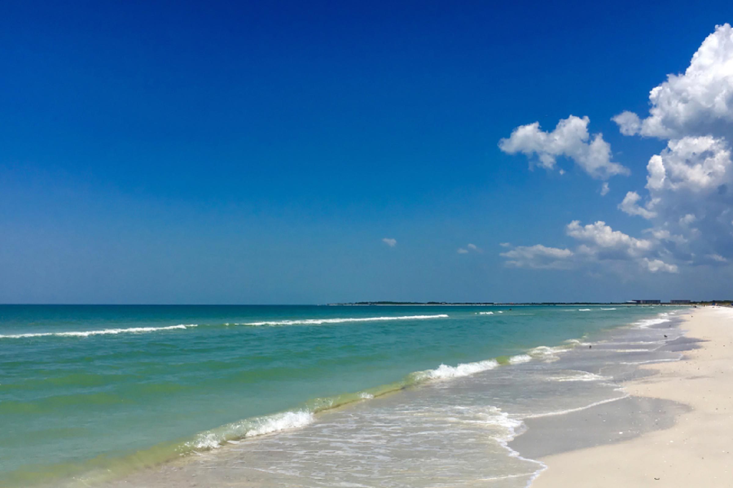 Caladesi island, Florida, USA: White sand beach with blue green waves in Caladesi island