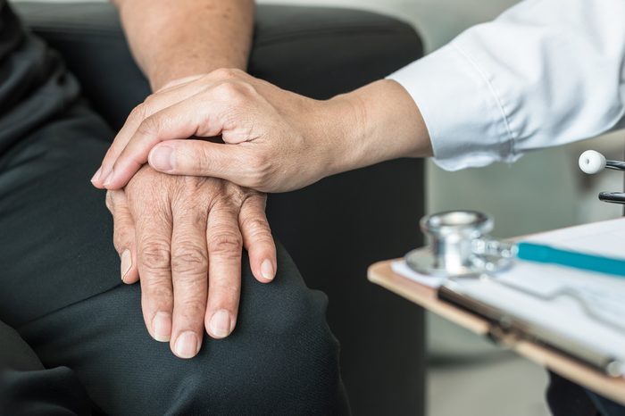 Geriatric doctor consulting and diagnostic examining elderly senior adult patient on aging, Parkinson's disease, Arthritis hand and knee pain and mental health care in medical exam clinic or hospital