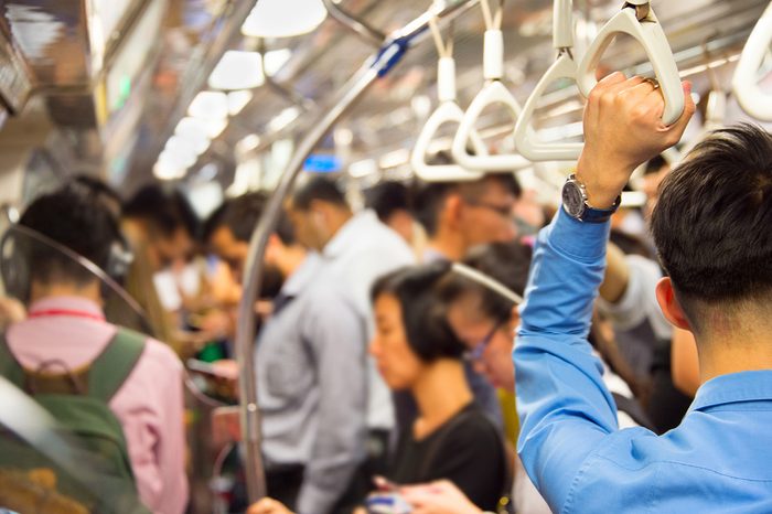 People inside the crowded metro train. Singapore