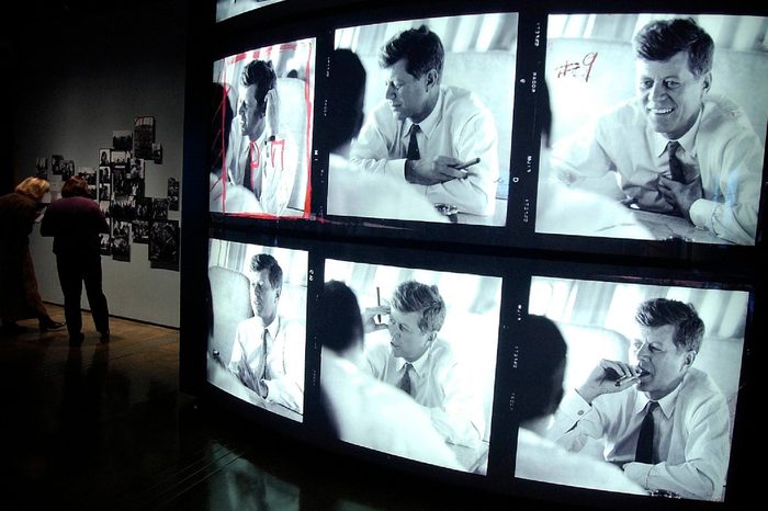 Photos of John F. Kennedy are seen at the Sixth Floor Museum in Dallas, . Hundreds of restored photographs taken by Jacques Lowe are on display beginning Nov. 22. These candid contact-sheet images, many never been seen before, are all that remains of the Lowe collection. More than 40,000 of his negatives of the Kennedy family were destroyed in the 2001 World Trade Center attacks