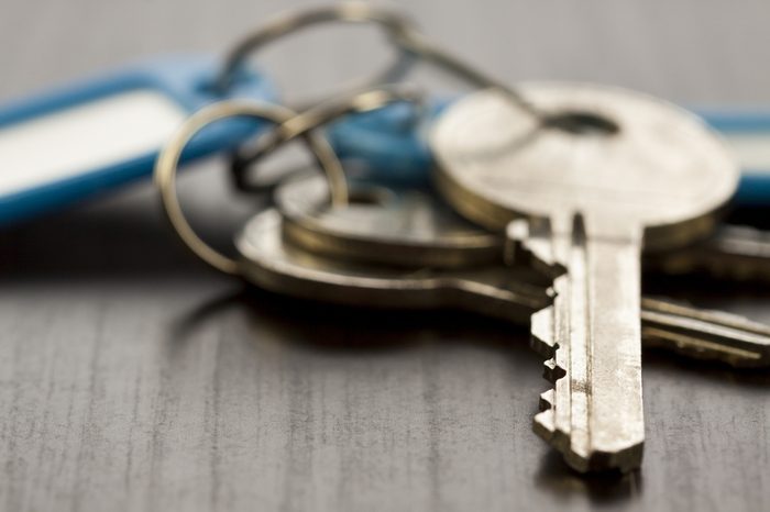 Macro Shot of Conceptual House Keys on Top of Wooden Table