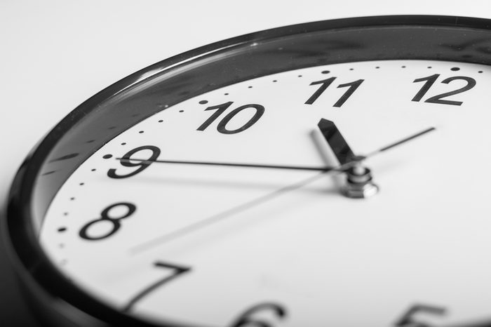 close up a wall clock that 20 min before 11 o'clock