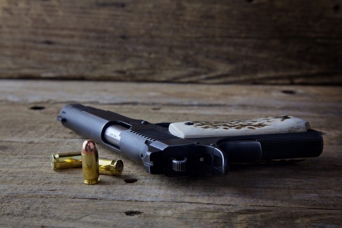 1911 pistol on wood table