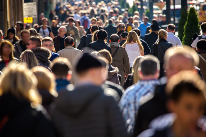 Anonymous crowd of people walking on a busy New York City street