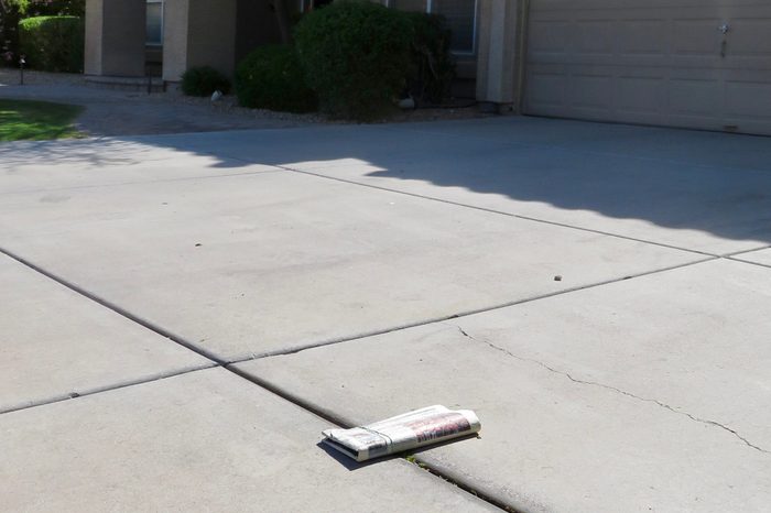 Newspaper delivered in driveway