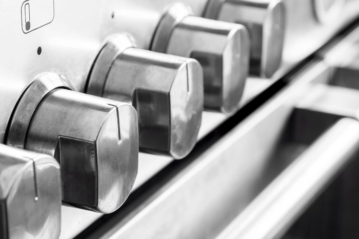 Close up image of stainless steel cooker controls