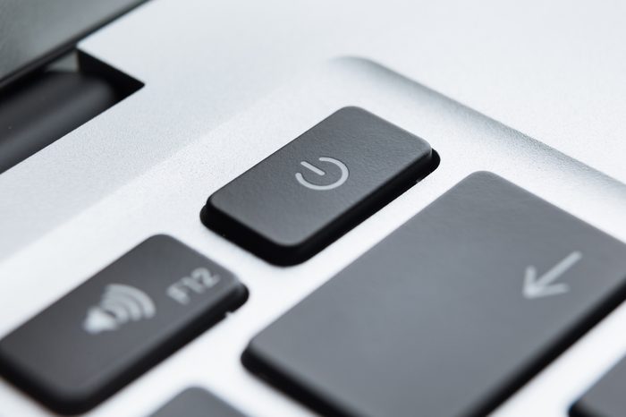 Close up of part of laptop keyboard. Focus on power button