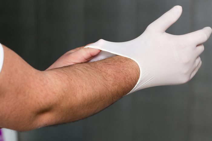 dentist puts gloves