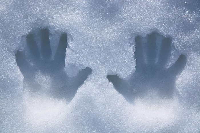 Left and right human prints in the snow.