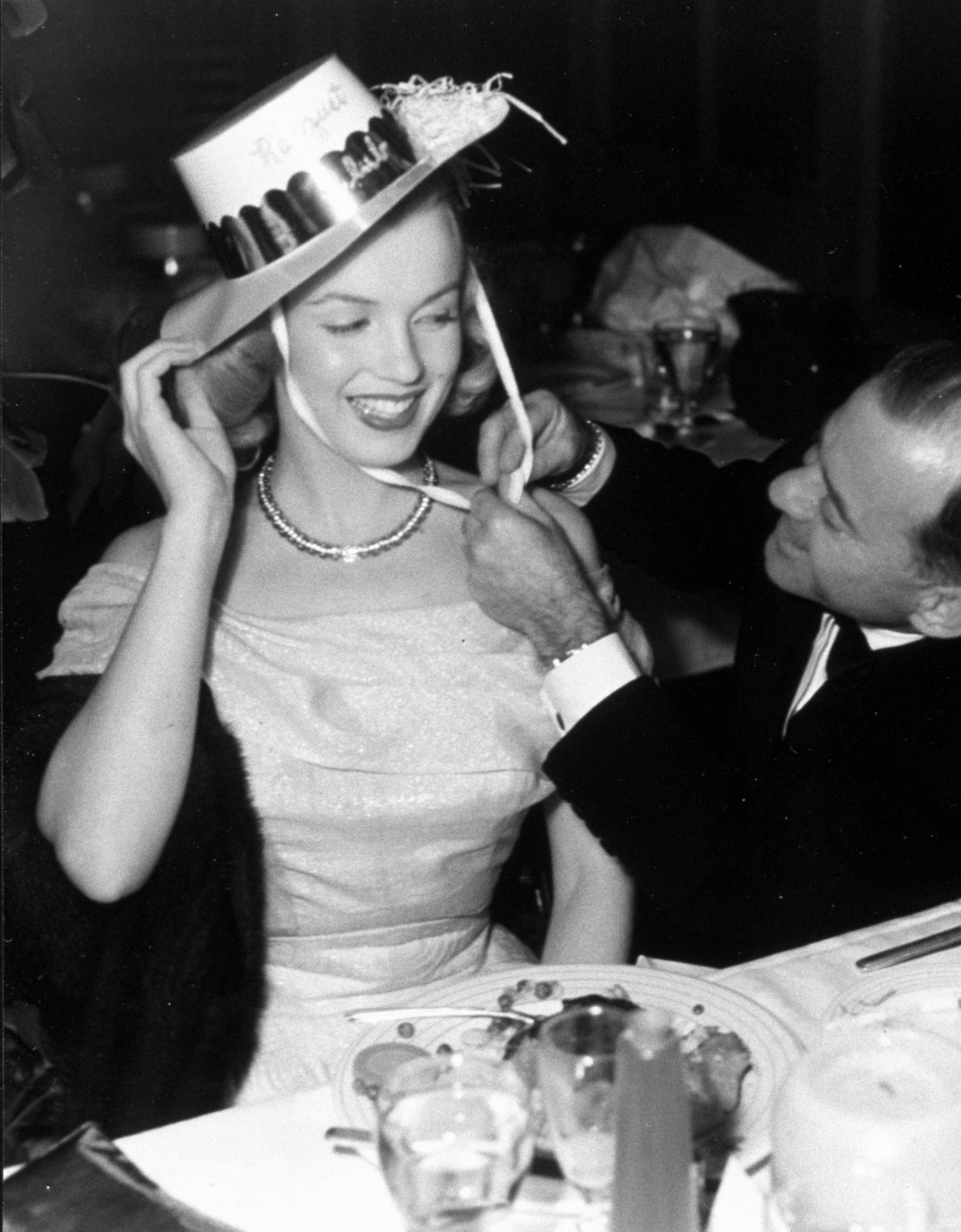 VARIOUS FILM STILLS OF 1949, CLOTHING, JOHNNY HYDE, MARILYN MONROE, CALIF. PALM SPRINGS, DINING, DRESSING, HAT, FUSSING, FLIRTING, COUPLE, MARRIED IN 1949