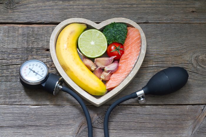 Health heart diet food concept with blood pressure gauge