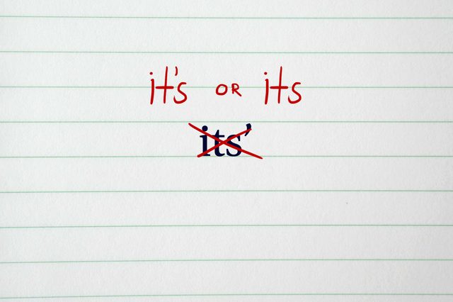 Text highlights English grammar. "It's or its" written in red. "Its'" crossed out below. Background is lined paper.