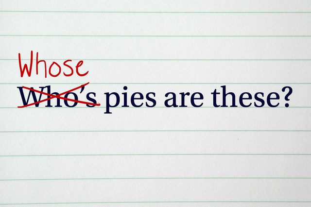 Text shows "Who's pies are these?" with "Who's" crossed out, corrected to "Whose" in red, on lined paper.