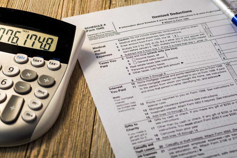 Tax reform concept with tax preparation forms for standardized deductions and mortgage interest deductions 