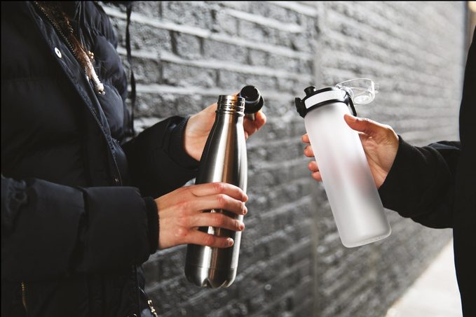 Women Exercising Outdoors In The City Street In A Rainy Day In London